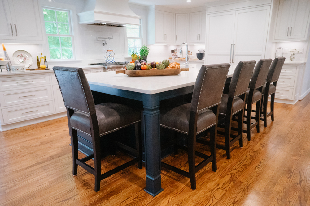 Dining area with a stone fireplace in the Buckingham Way home